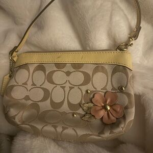 Coach Beige and Yellow Wristlet with Floral Accent